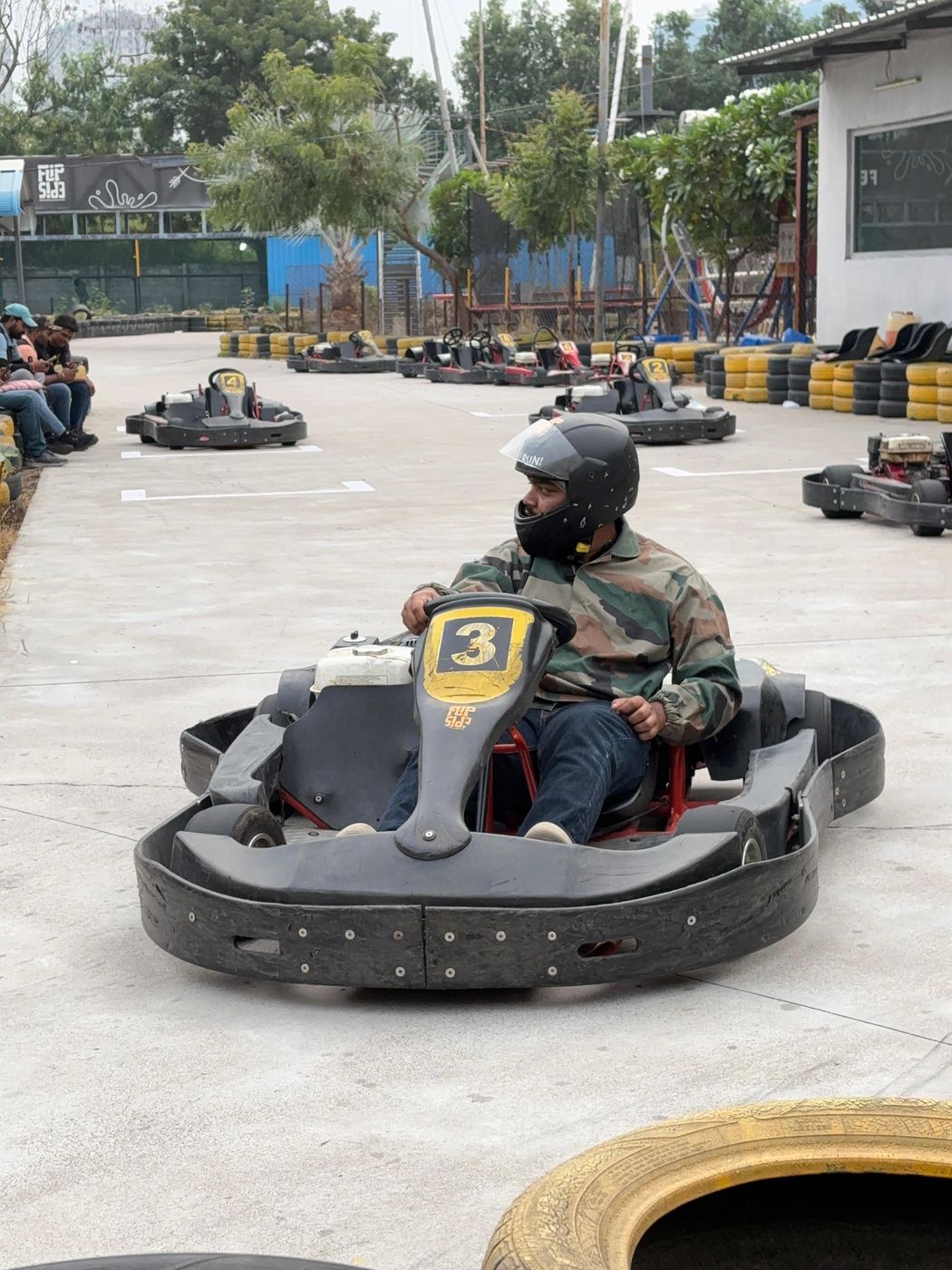 Jai in a go-kart on a track